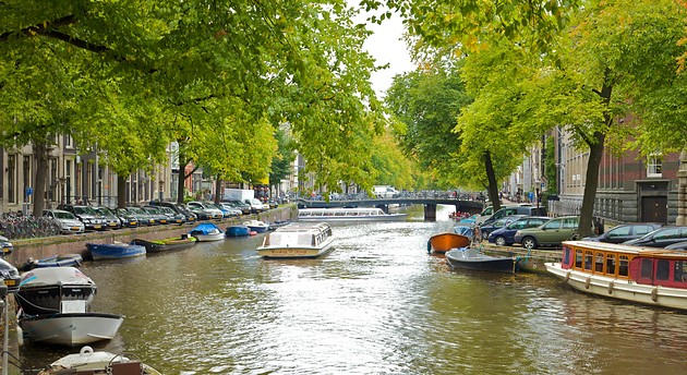 A canal boat coasts downstream
